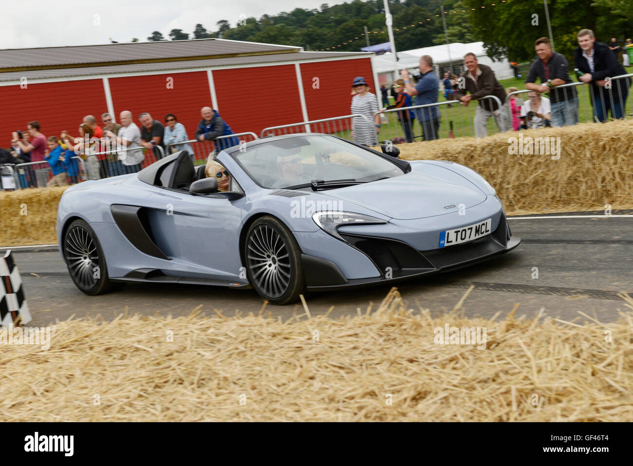 Bolesworth, Cheshire, UK. 29th July 2016. A McLaren being driven round the track. The event is the brainchild of Chris Evans and features 3 days of cars, music and entertainment with profits being donated to the charity Children in Need. Credit:  Andrew Paterson/Alamy Live News Stock Photo
