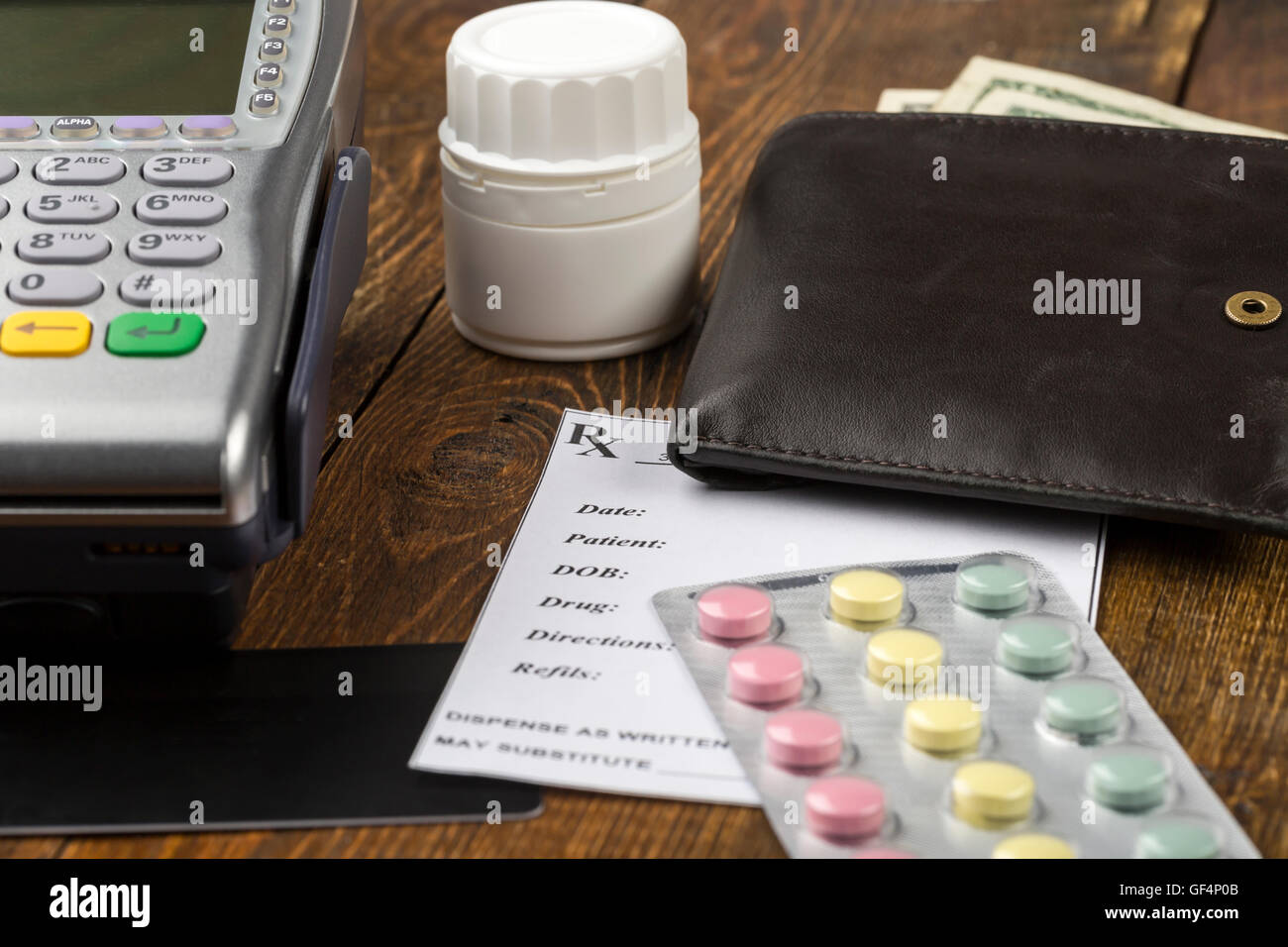 Pos terminal and leather wallet with paper money Stock Photo