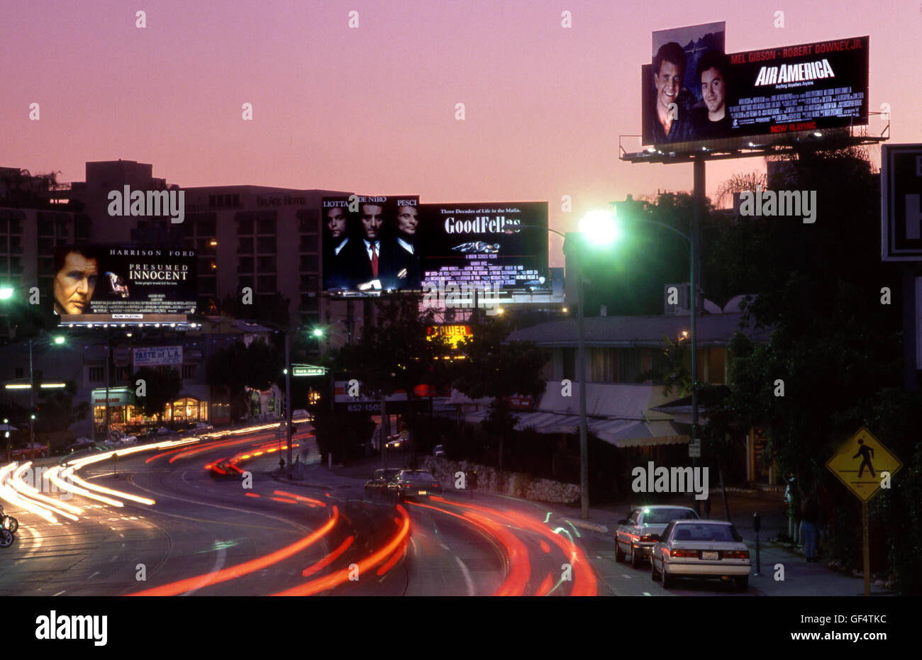 Movie billboards depicting major male film stars on the Sunset Strip in Los Angeles, CA circa 1990 Stock Photo