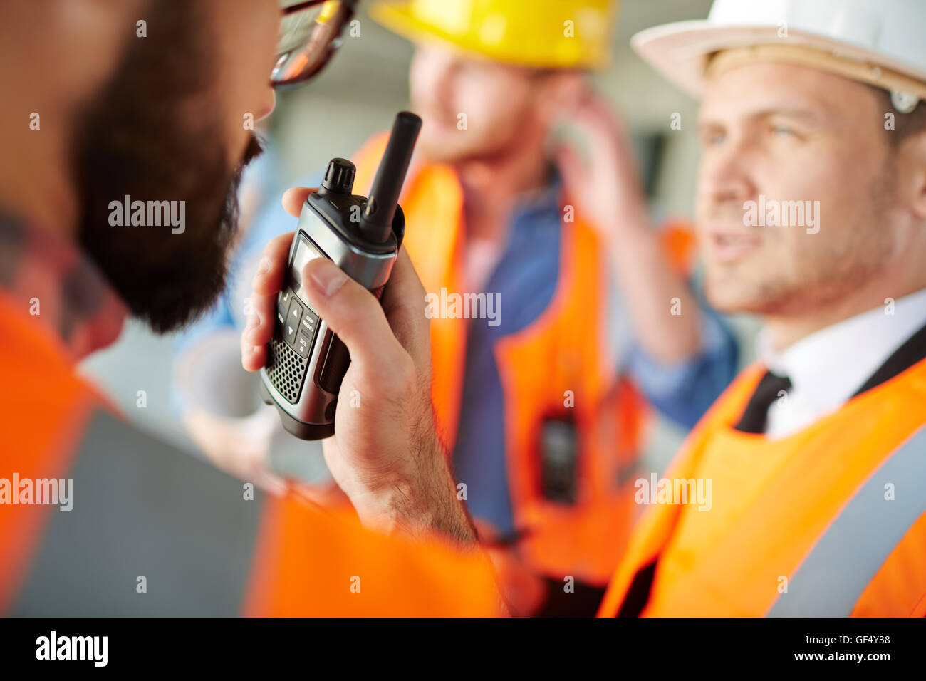 Reporting by portable radio system Stock Photo