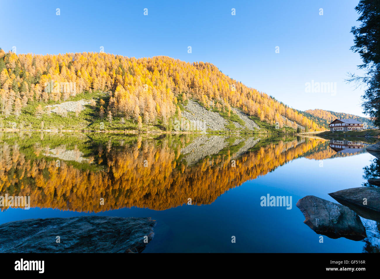 Mountain panorama from Italian Alps. Reflections on water from 'Calaita' lake. Beautiful dolomites Stock Photo