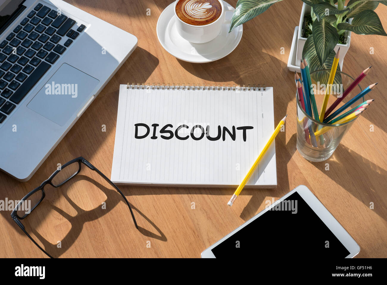 DISCOUNT open book on table and coffee Business Stock Photo Alamy