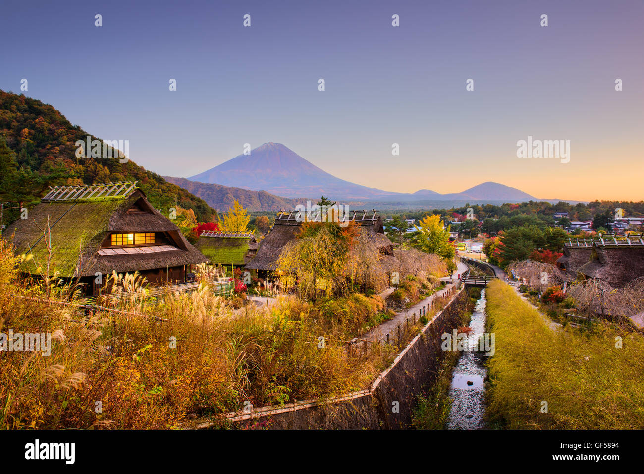 Mt. Fuji, Japan with historic village Iyashi no Sato during autumn. Stock Photo