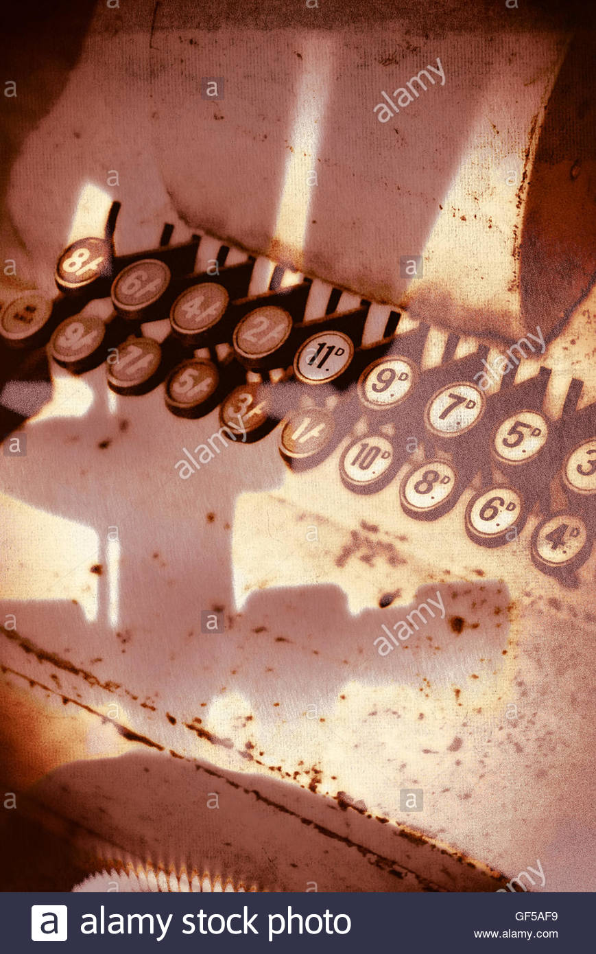 Vintage shop till keys moody image with strong shadows Stock Photo
