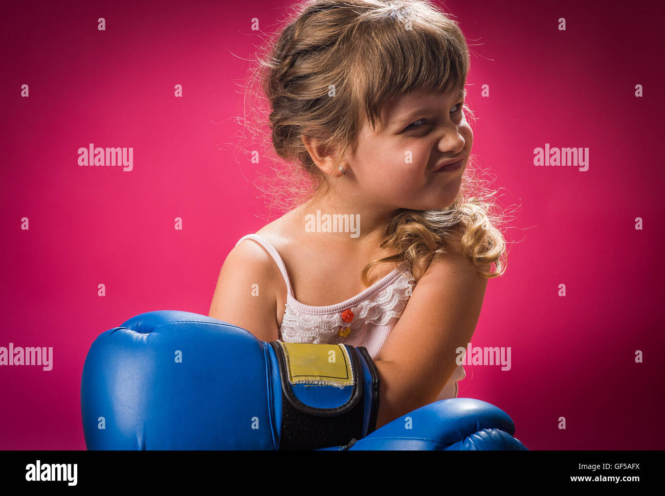 Little girl wearing blue boxing gloves Stock Photo Alamy