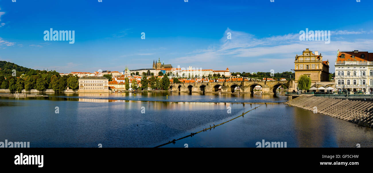 famous view of the prague castle and the charles bridge in prague which every year attracts millions of tourists from all around Stock Photo