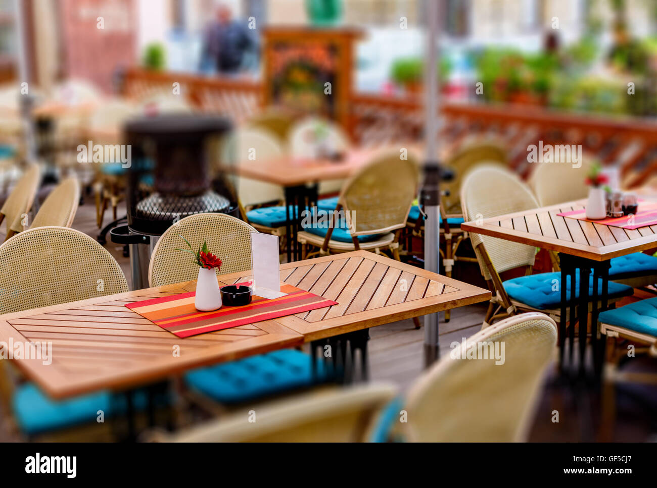 treet view of a Cafe terrace with tables and chairs in european city Stock Photo