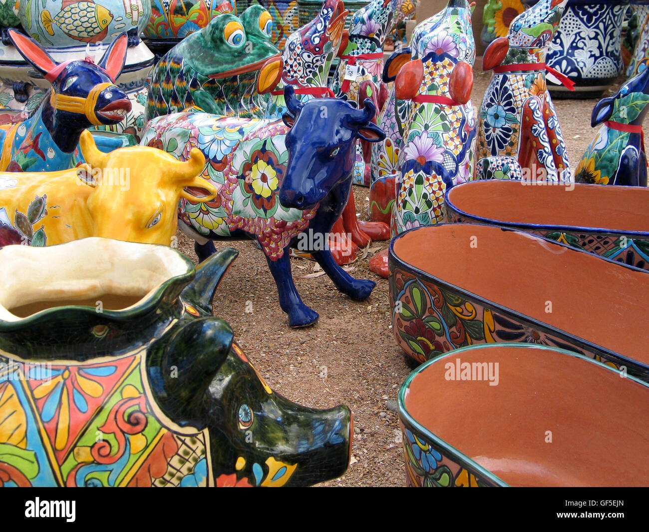 A wild collection of brightly glazed pottery and southwestern art are gathered at an open market in Tucson, Arizona, USA. Stock Photo