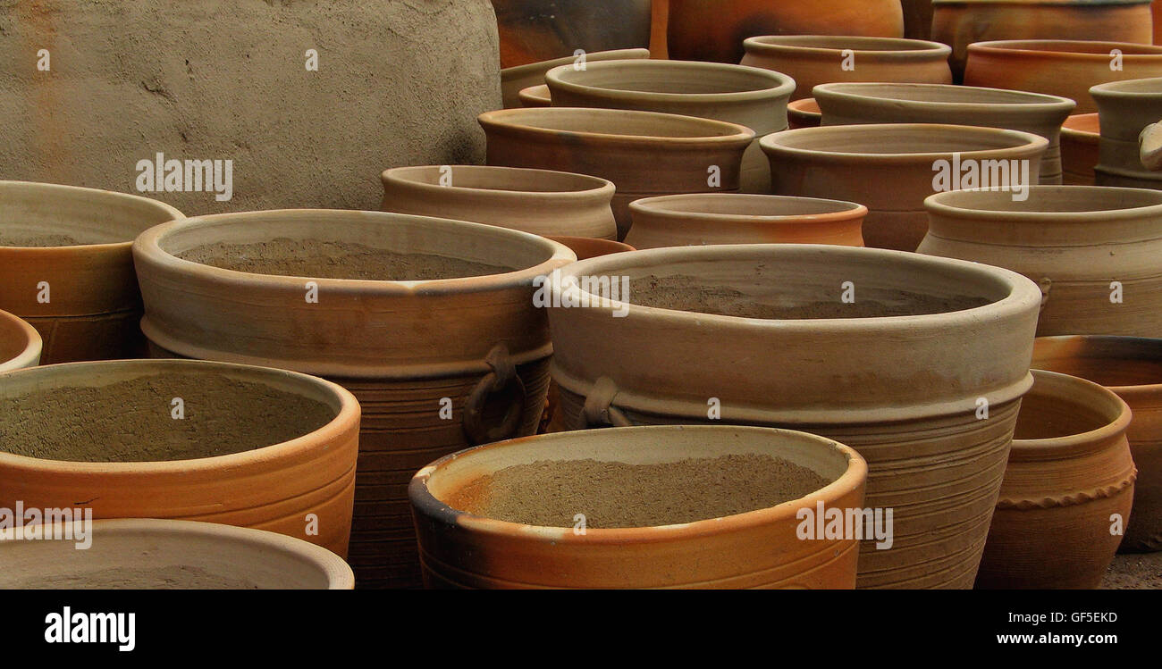 Large Terracotta clay pots at a market in Tucson Arizona, make an interesting study of circular and elliptical patterns. Stock Photo