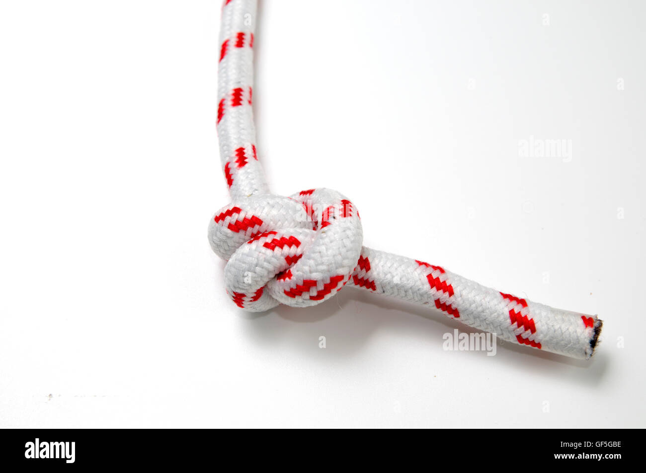 Double overhand knot AKA double granny knot on white background Stock Photo