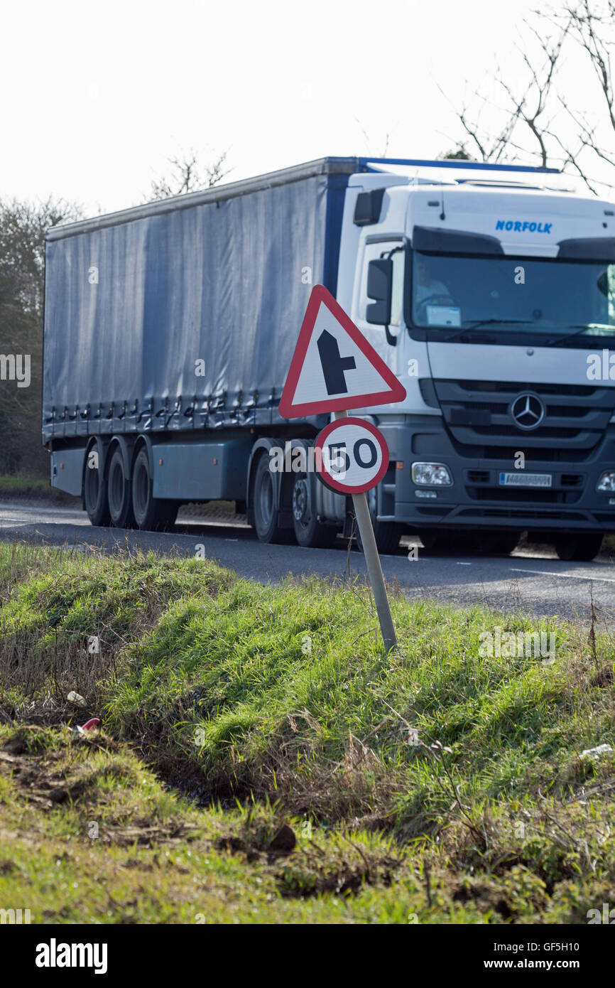 Heavy Vehicle Traffic. Speed Limit Sign. Rural Road. Norfolk. England. UK. Stock Photo