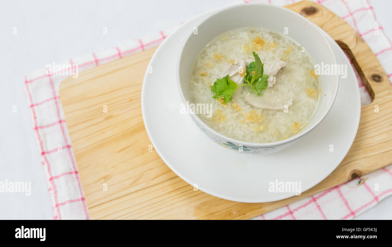 Thai style rice boiled with pork in bowl Stock Photo - Alamy
