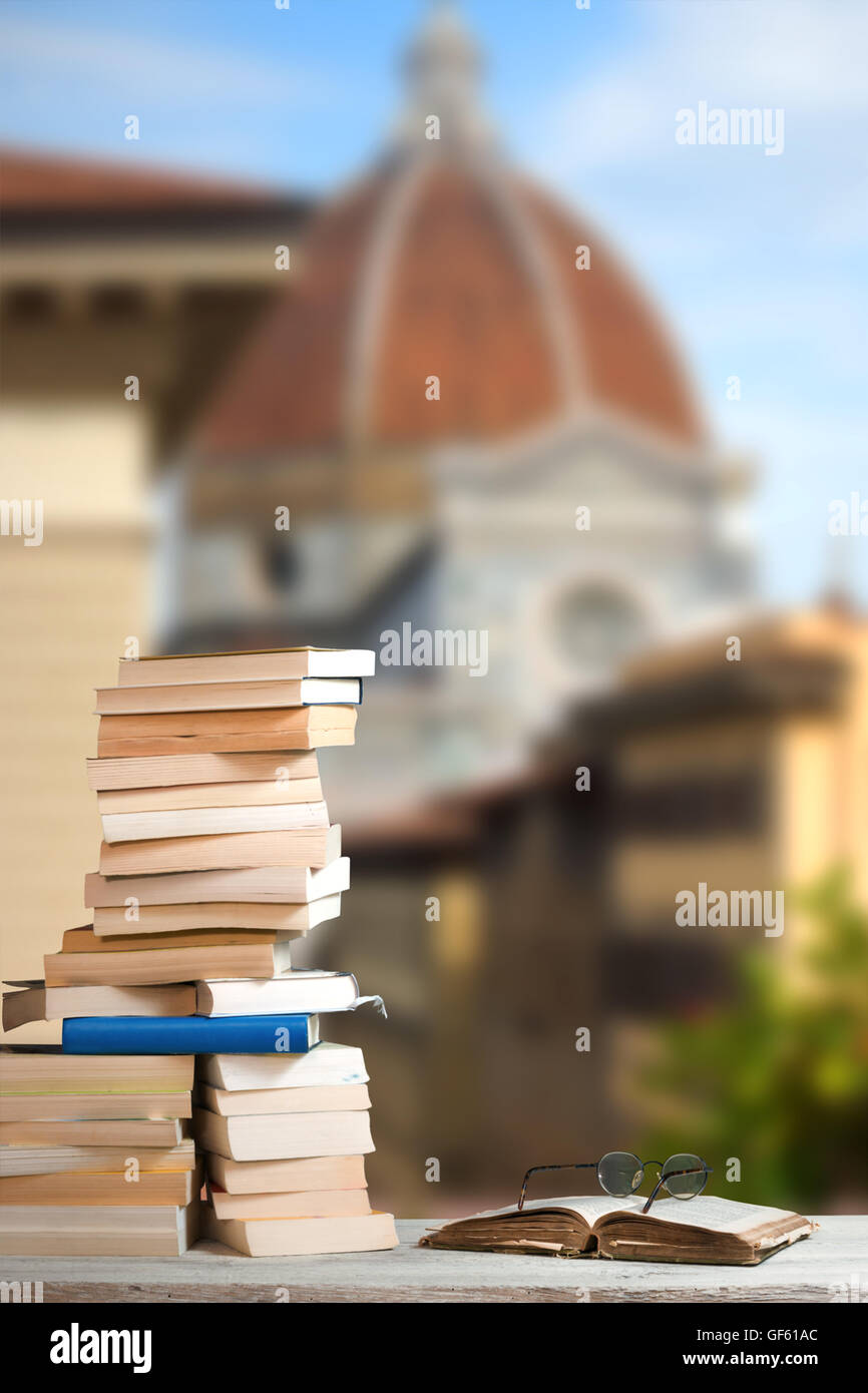 Stack of Travel Guides before the Duomo in Florence Stock Photo