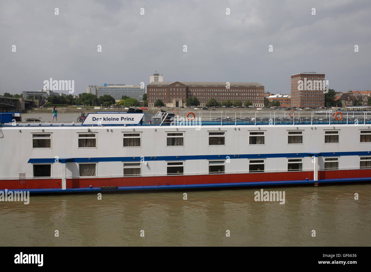 Der kleine Prinz German cruise boat with Konica Minolta office on Pest side of Danube beyond Stock Photo