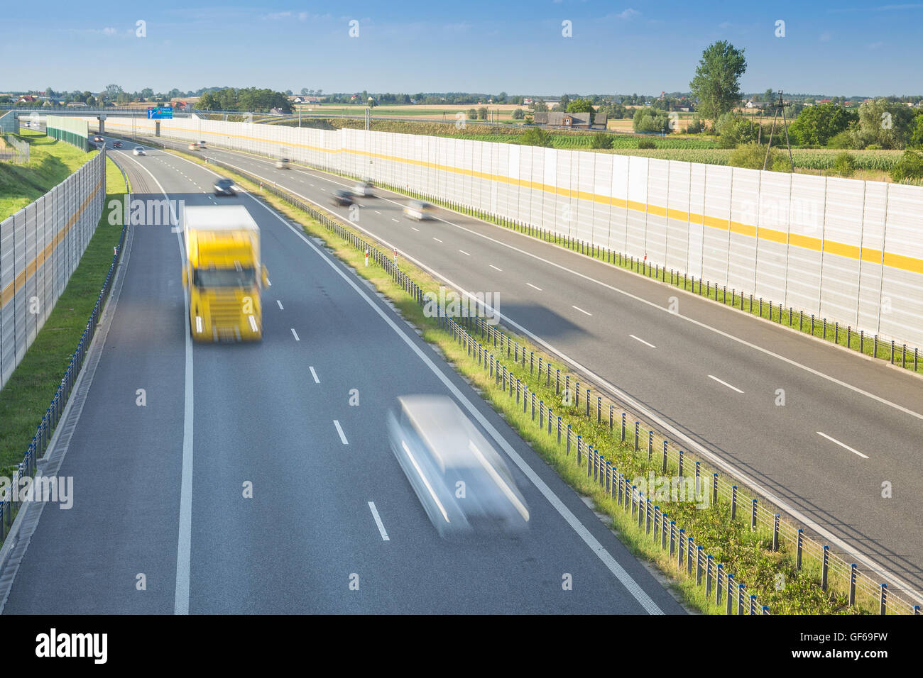 Noise barriers by the highway in rural county Stock Photo