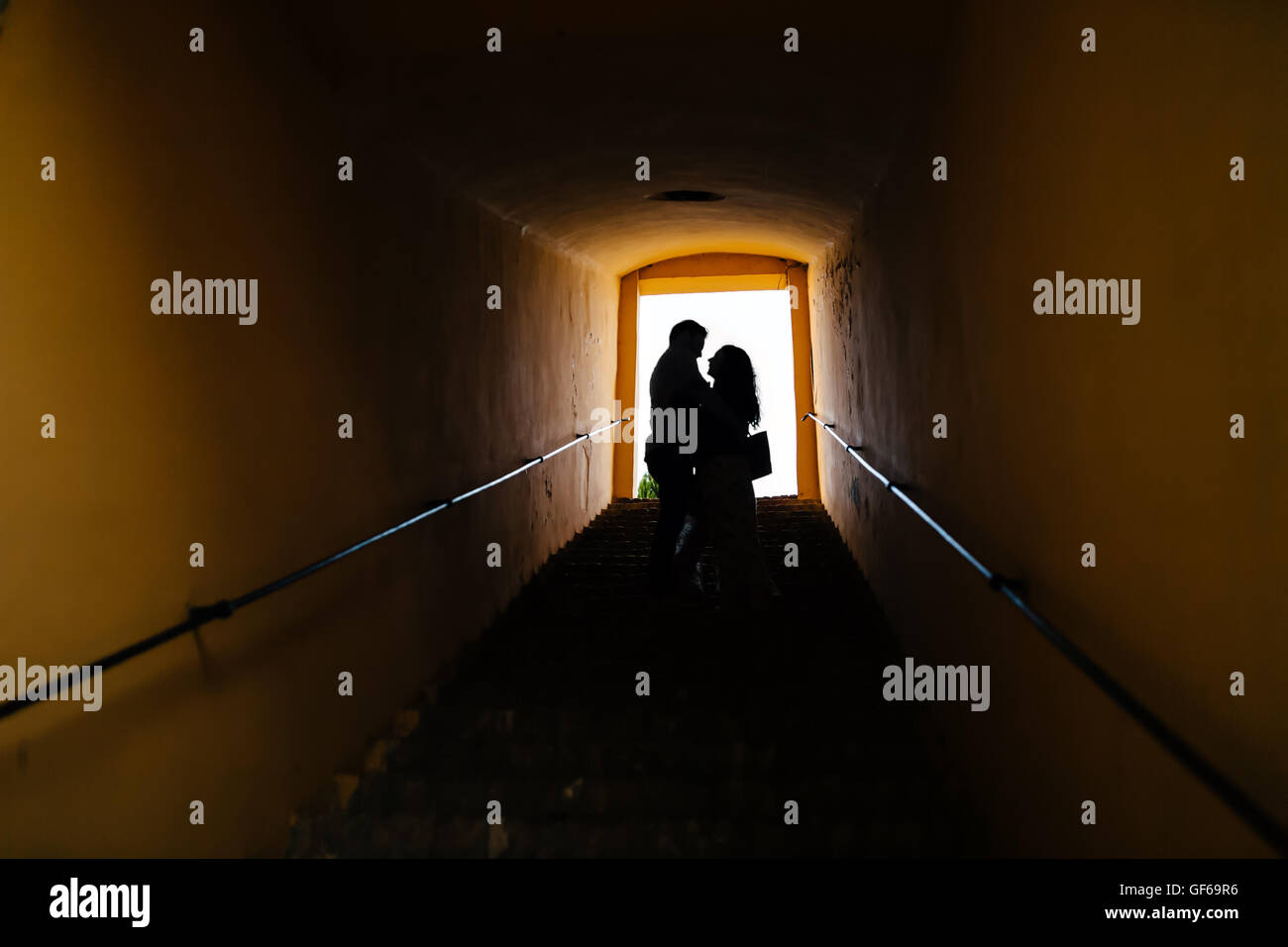 Silhouette of a couple in love hugging Stock Photo