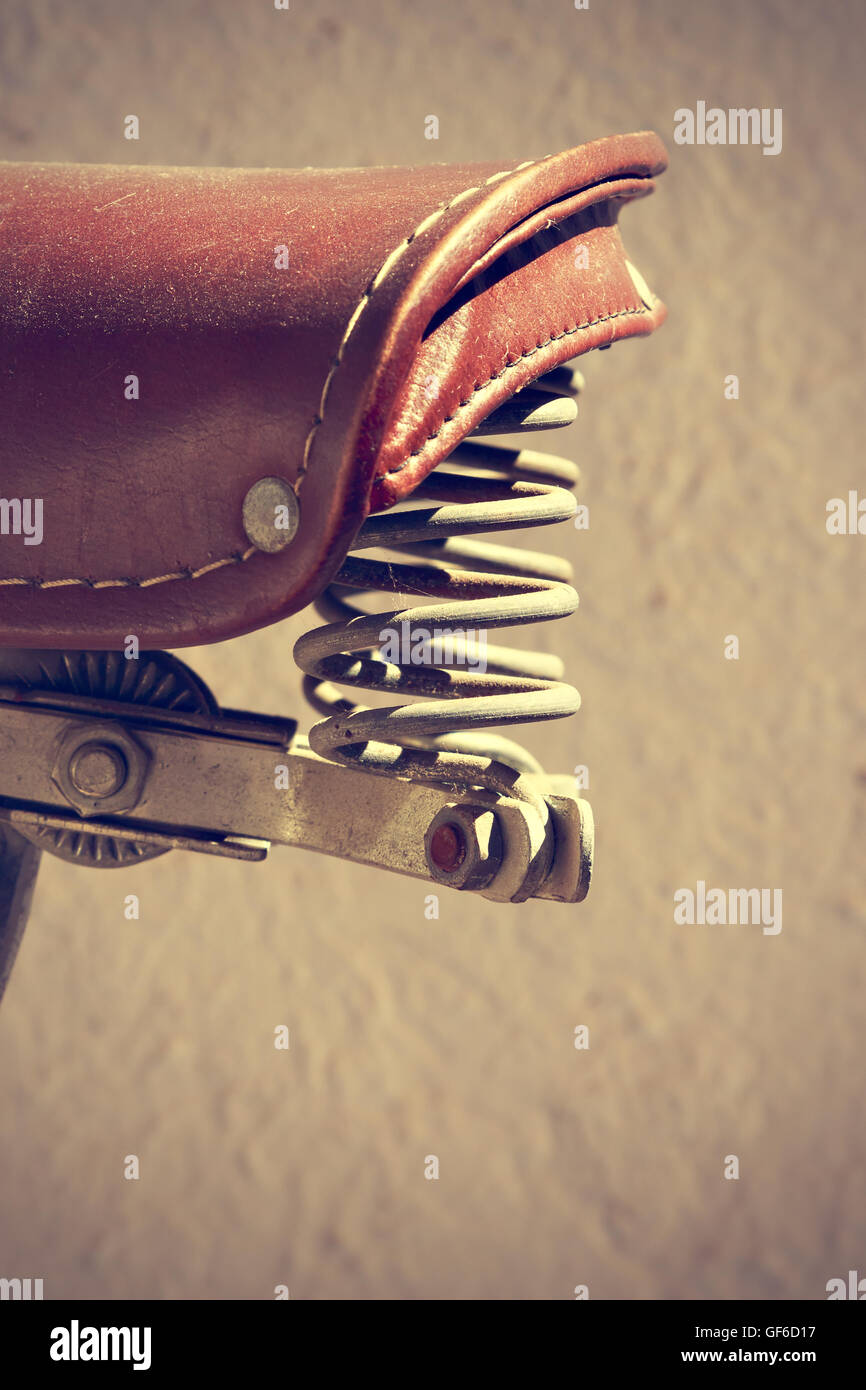 Detail of retro bike saddle. Suspension mechanism have two springs