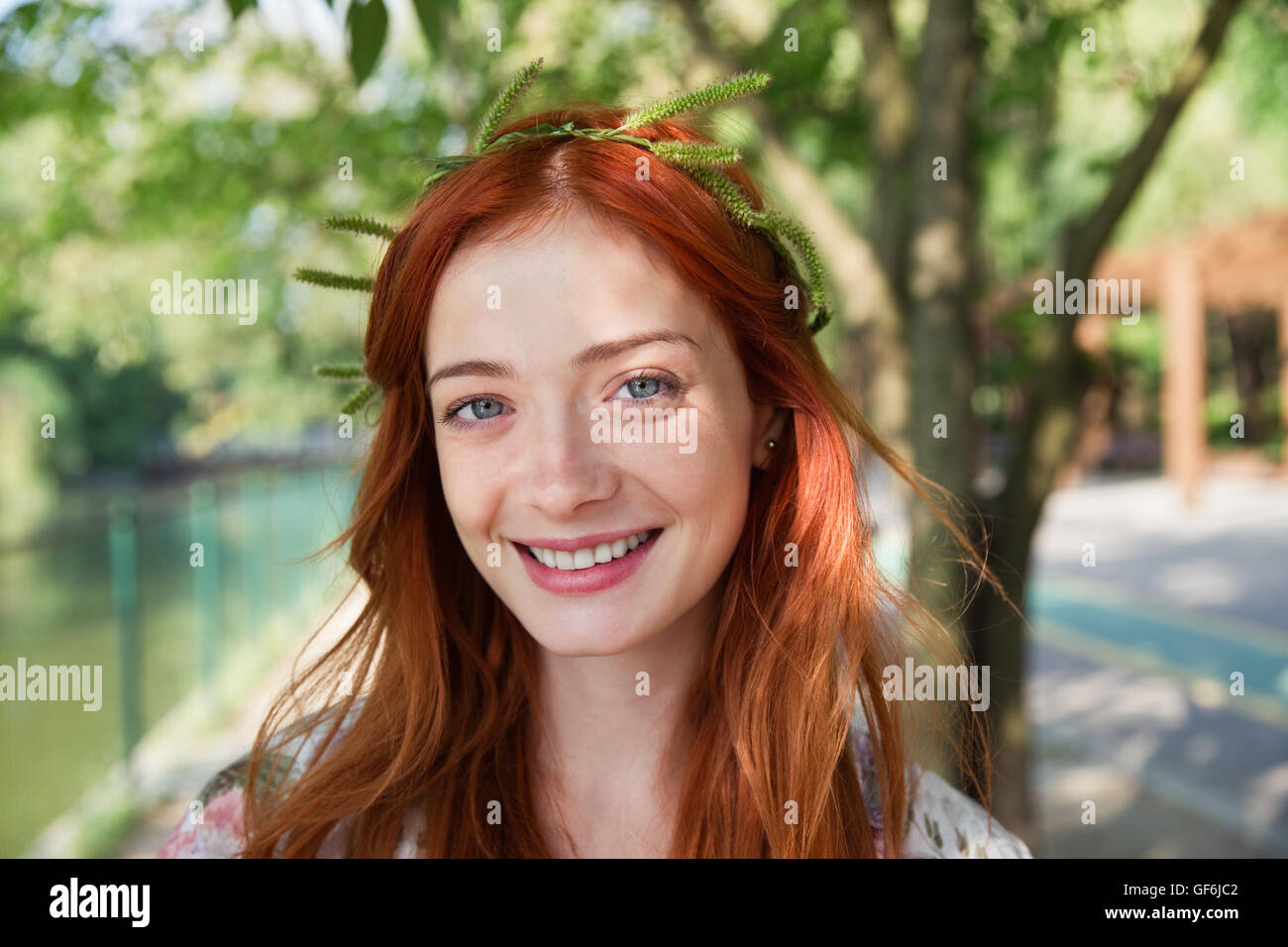 Portrait of young woman smiling Stock Photo - Alamy