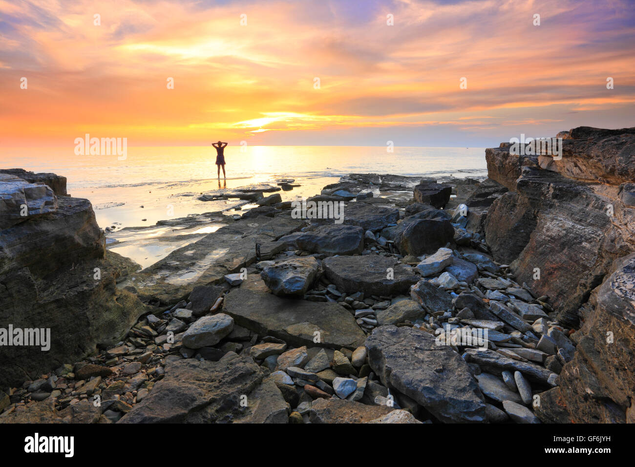 Woman sunset beach carefree hi-res stock photography and images - Alamy