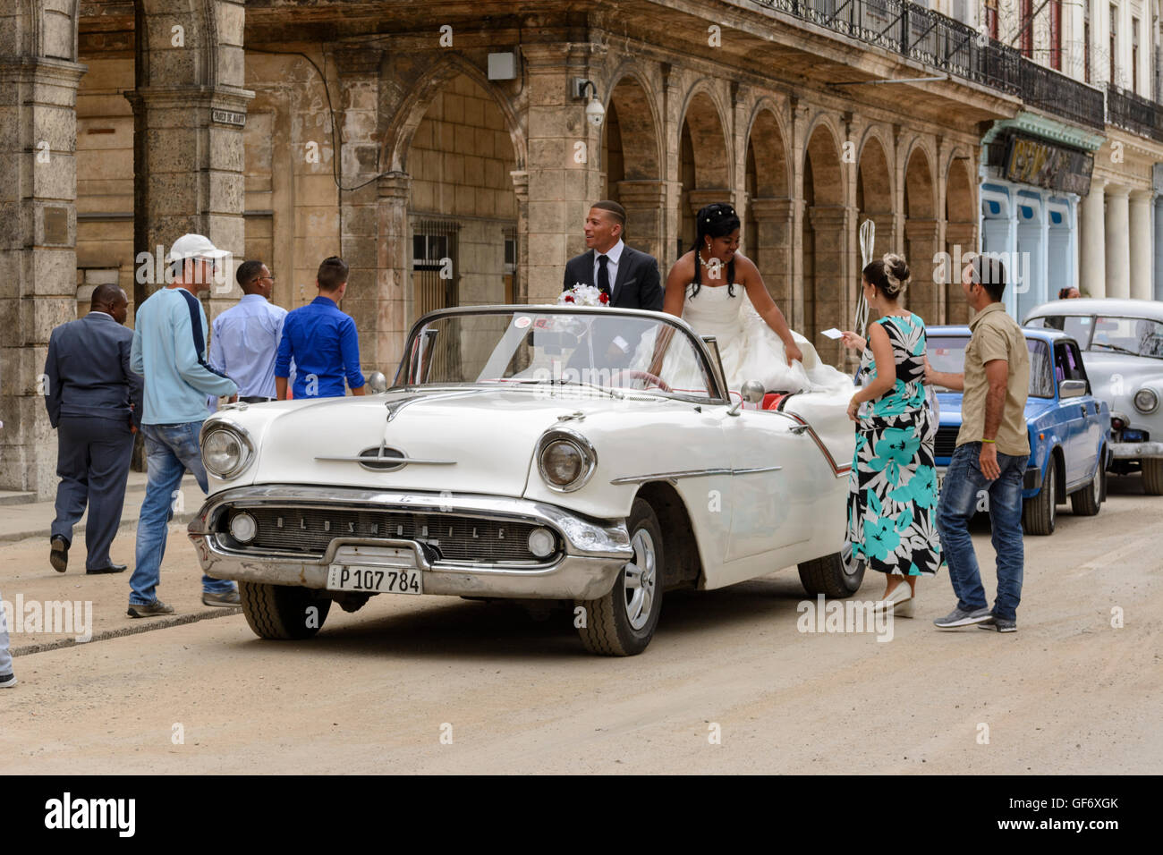 Newly weds celebrate their wedding with a tour of Havana in an open top classic car, Paseo de Marti (Prado), Old Havana, Cuba Stock Photo