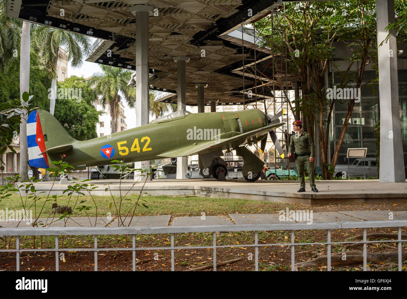 A Cuban soldier guards an old military aeroplane at the Museum of the Revolution (Museo de la Revolucion), Havana (Habana), Cuba Stock Photo