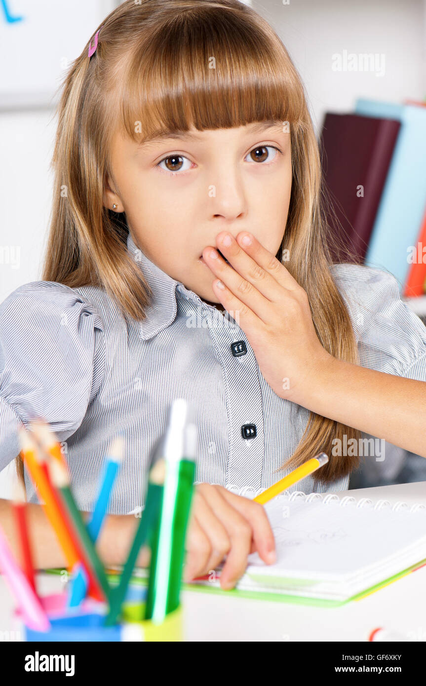 Girl in school at the desk Stock Photo - Alamy