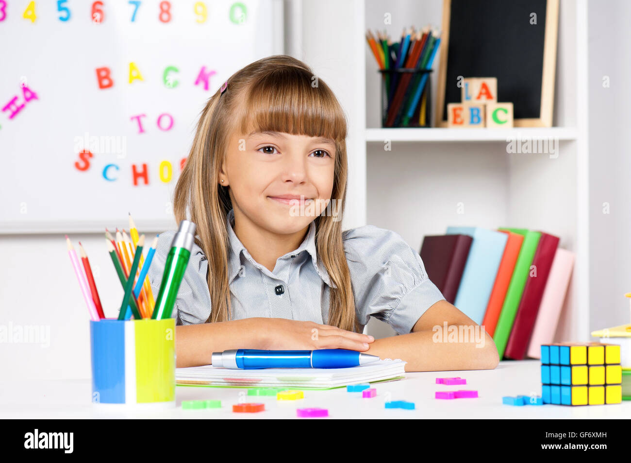 Cute little girl in the classroom hires stock photography and images
