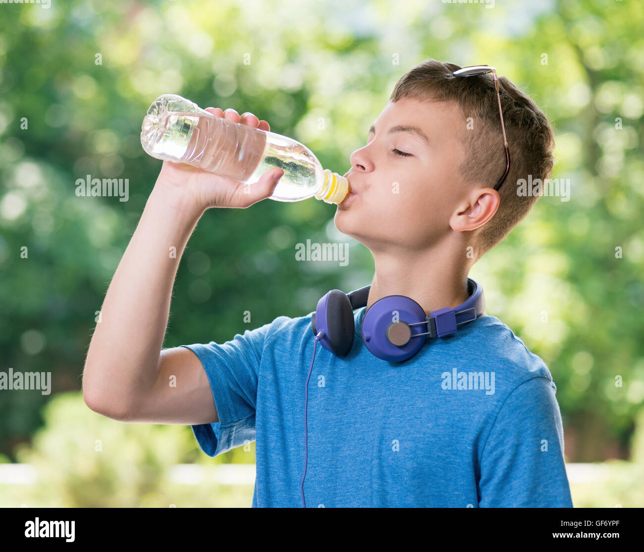 Teen boy drinking water Stock Photo
