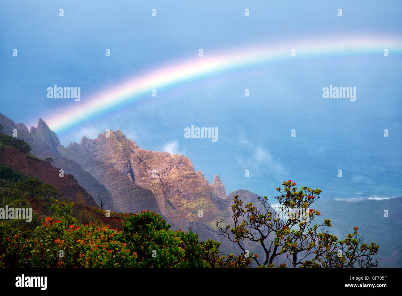 Rainbow as seen from Kalalau Lookout. Waimea Canyon. Kauai, Hawaii,ocean,oceans,oceanic,sea,seas,seascape, seascapes,beach,beach Stock Photo