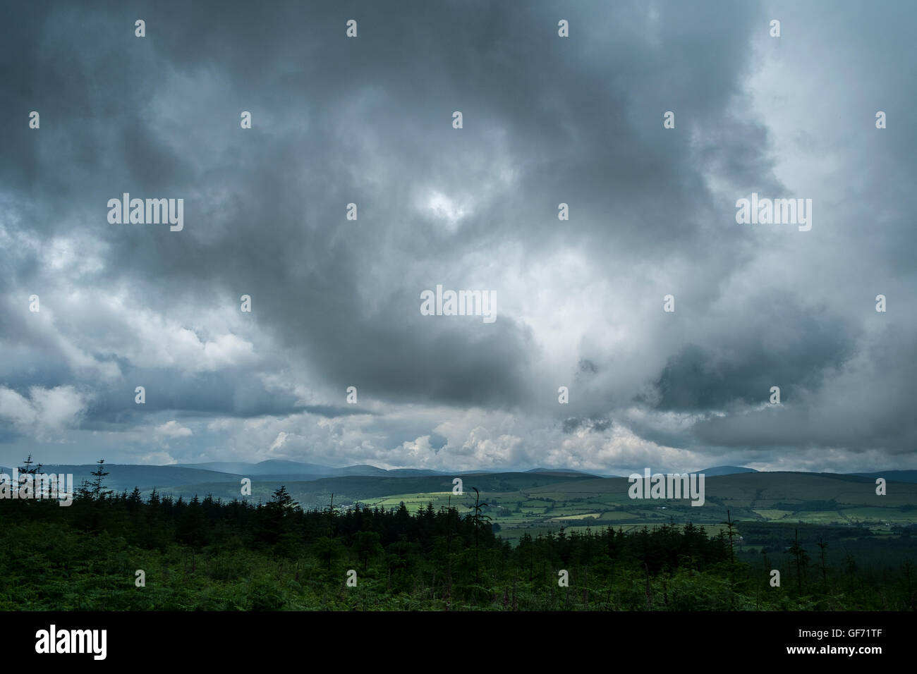 dark heavy storm clouds stormy conditions weather Stock Photo