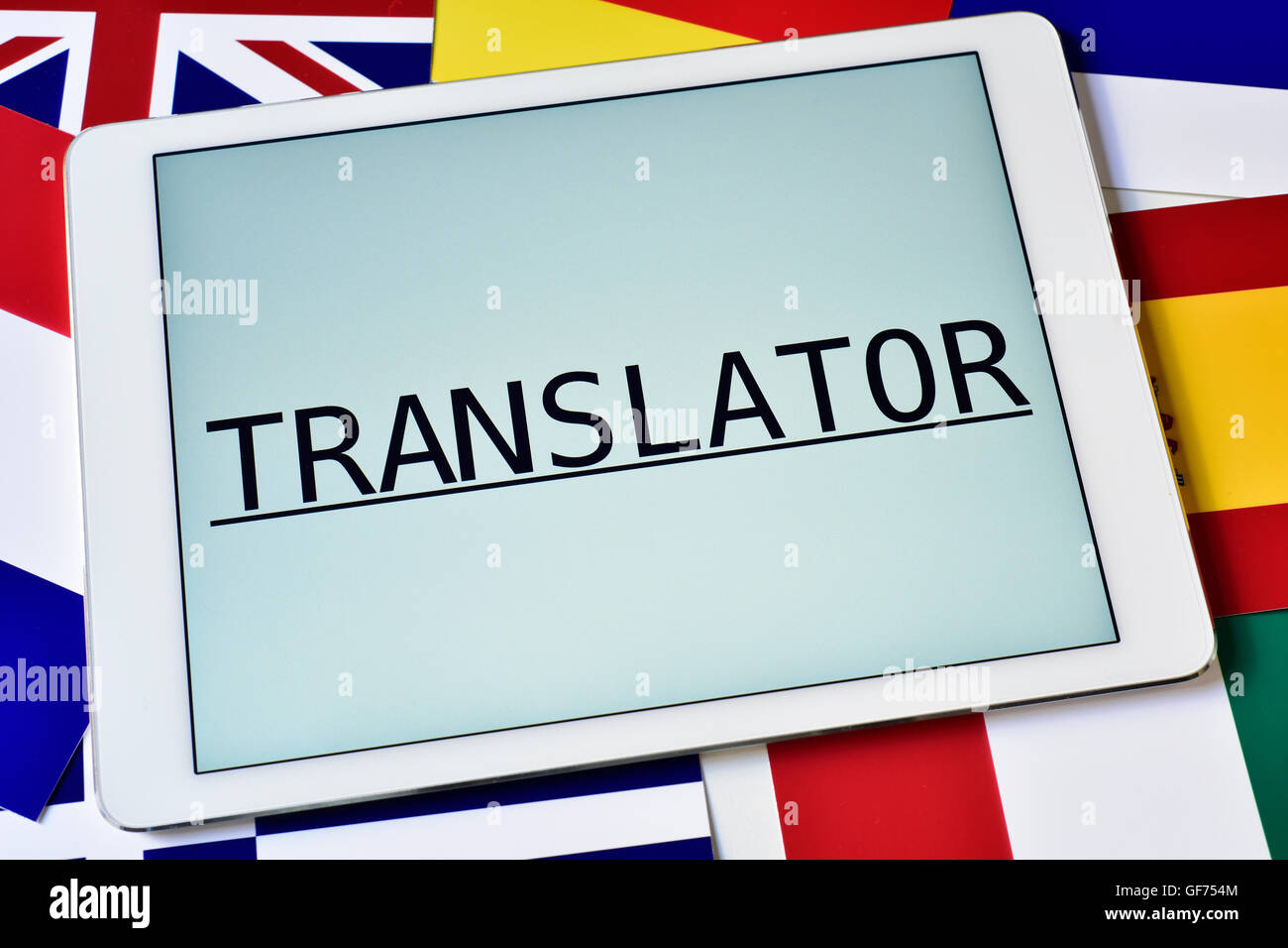 the word translator in the screen of a tablet computer surrounded by