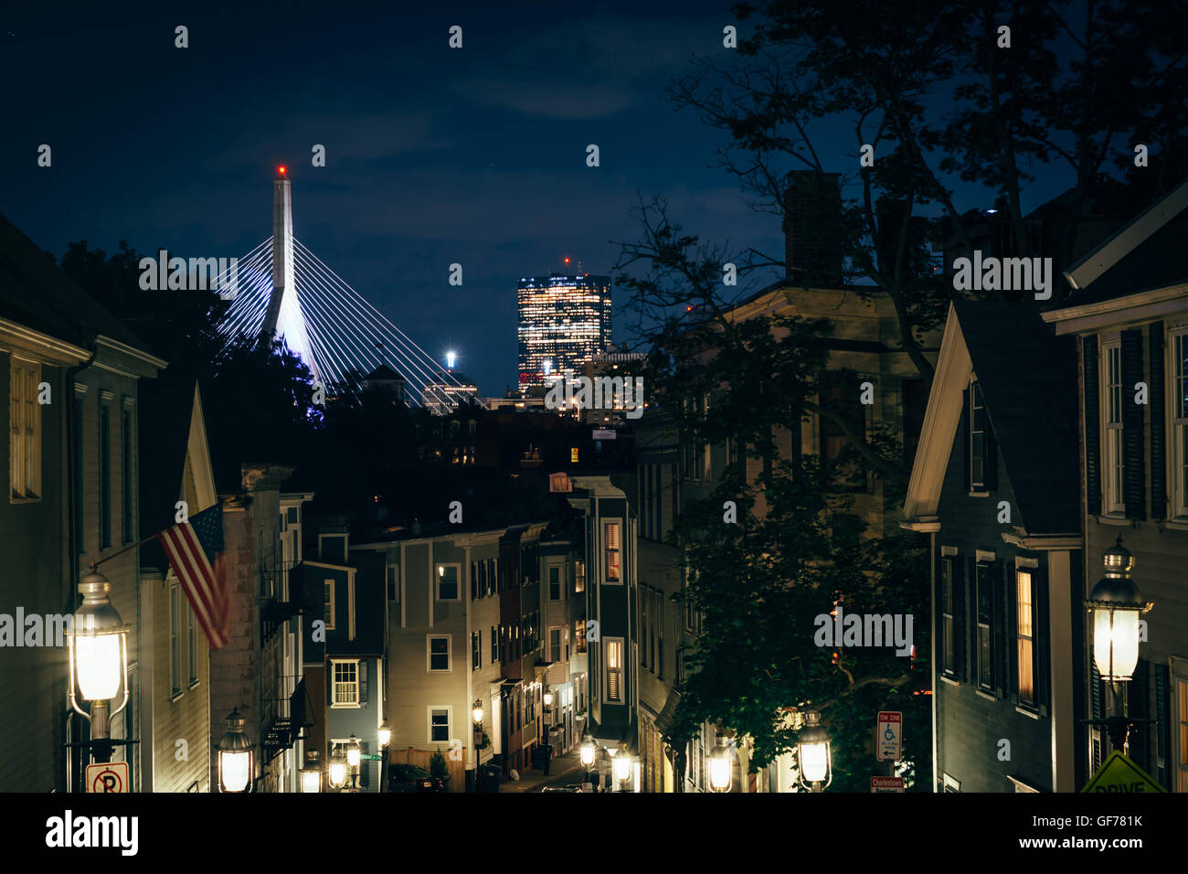 Pleasant Street and the Zakim Bridge in the distance at night, in Bunker Hill, Charlestown, Boston, Massachusetts. Stock Photo