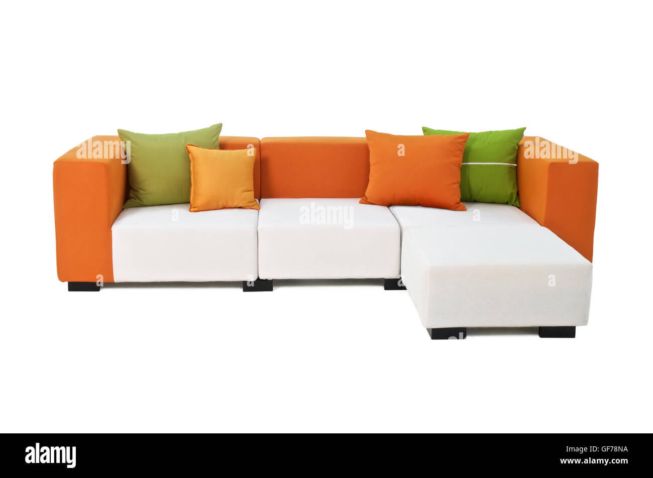 Outdoor indoor sofa with water resistant  orange and green pillows, comfortable corner set furniture Stock Photo