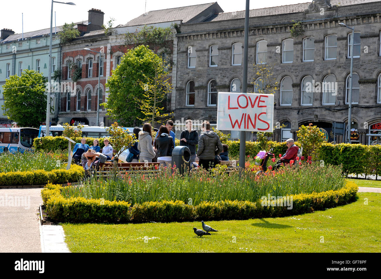 Irish teenagers in park with Love Wins poster, Derry, Londonderry, Northern Ireland Stock Photo