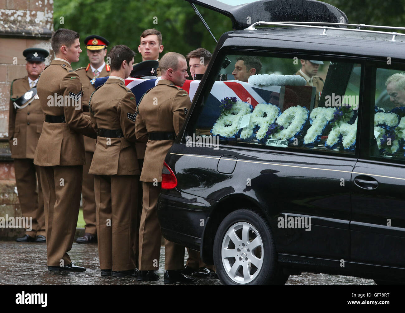 The coffin of Corporal Josh Hoole is taken into Crichton Memorial church in Dumfries for his funeral. Stock Photo