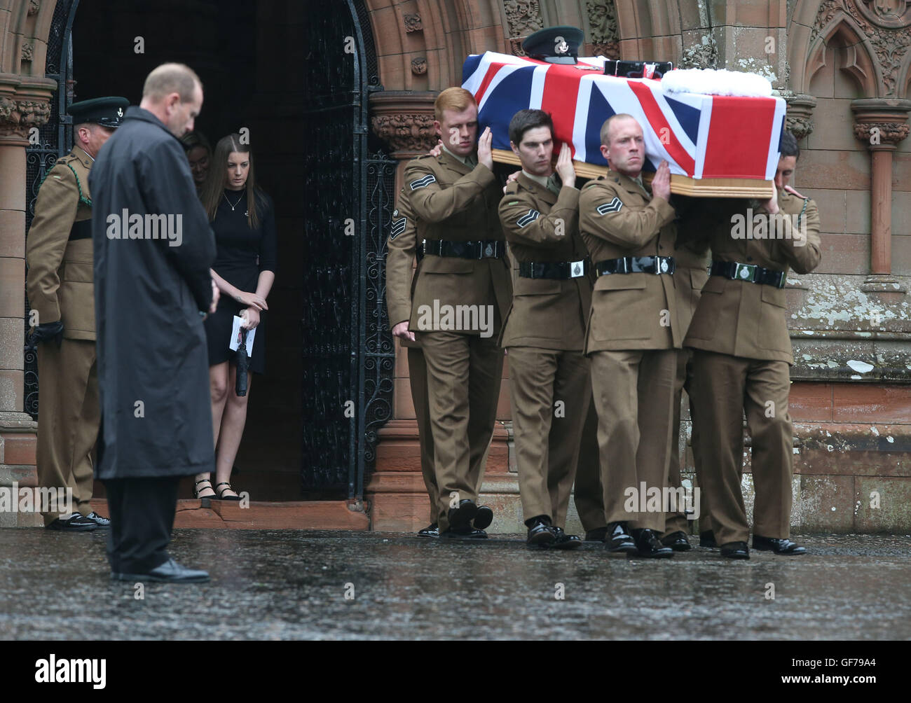 Fiancee Rachael McKie follows the coffin as it is brought out from Crichton Memorial church in Dumfries after the funeral of Corporal Josh Hoole. Stock Photo