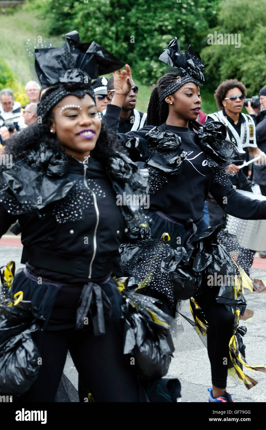 Two black female dancers taking part in the Carnival Parade, part of the Edinburgh Jazz Festival. Stock Photo