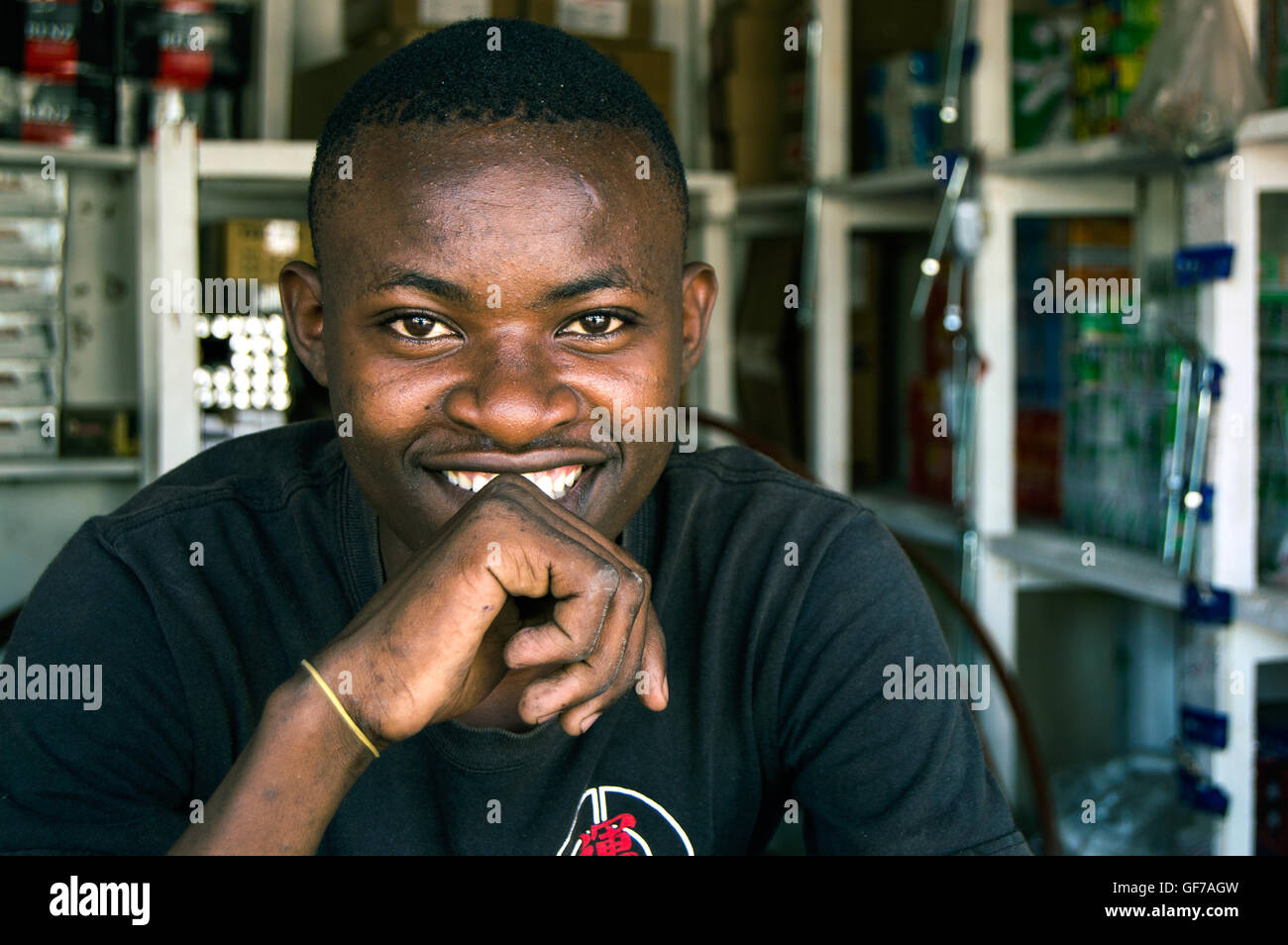 Man in hardware store, Msasani, Dar-es-Salaam, Tanzania Stock Photo