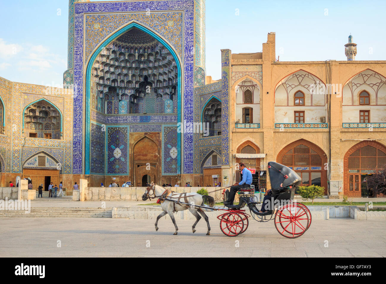 Old style cab in Naqsh-e Jahàn Square, Isfahan, Iran. On the background the Shah Mosque Stock Photo
