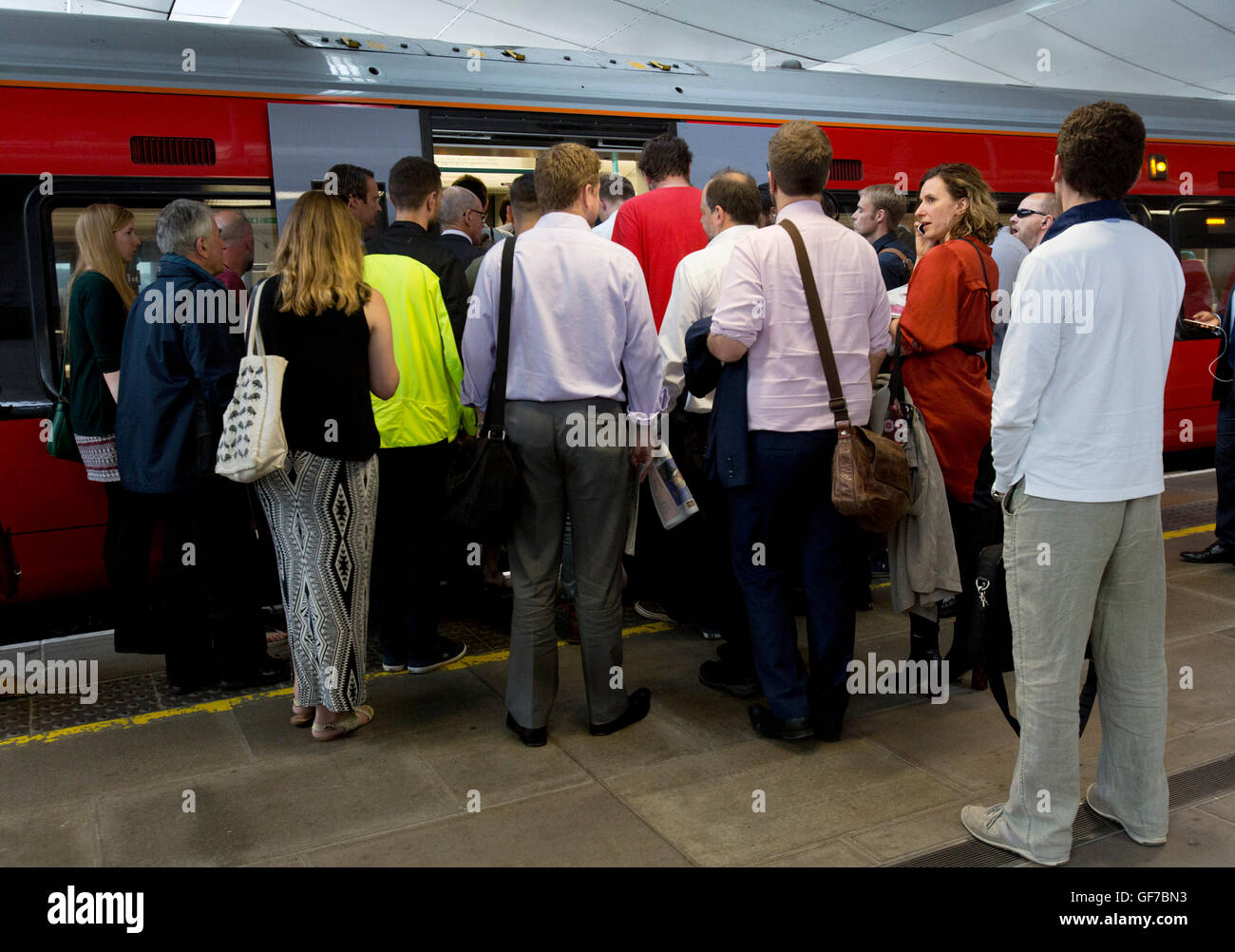 Commuters waiting to board a train at Blackfriars station, London, during the evening rush hour, as Department for Transport figures show that the station has the highest percentage of passengers above the official capacity for their service out of all major stations in the capital at 14% in the morning peak. Stock Photo