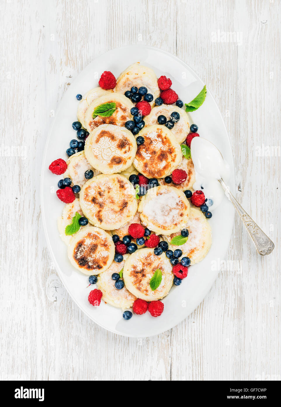 Syrniki Or Cottage Cheese Pancakes With Fresh Forest Berries And