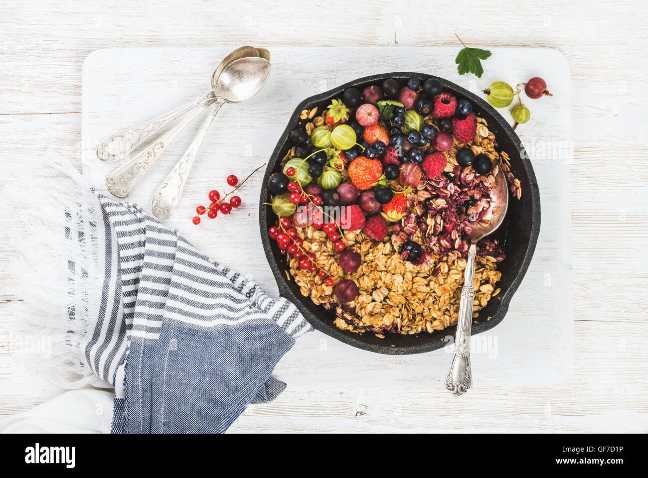 Oat granola crumble with fresh garden berries and seeds Stock Photo Alamy