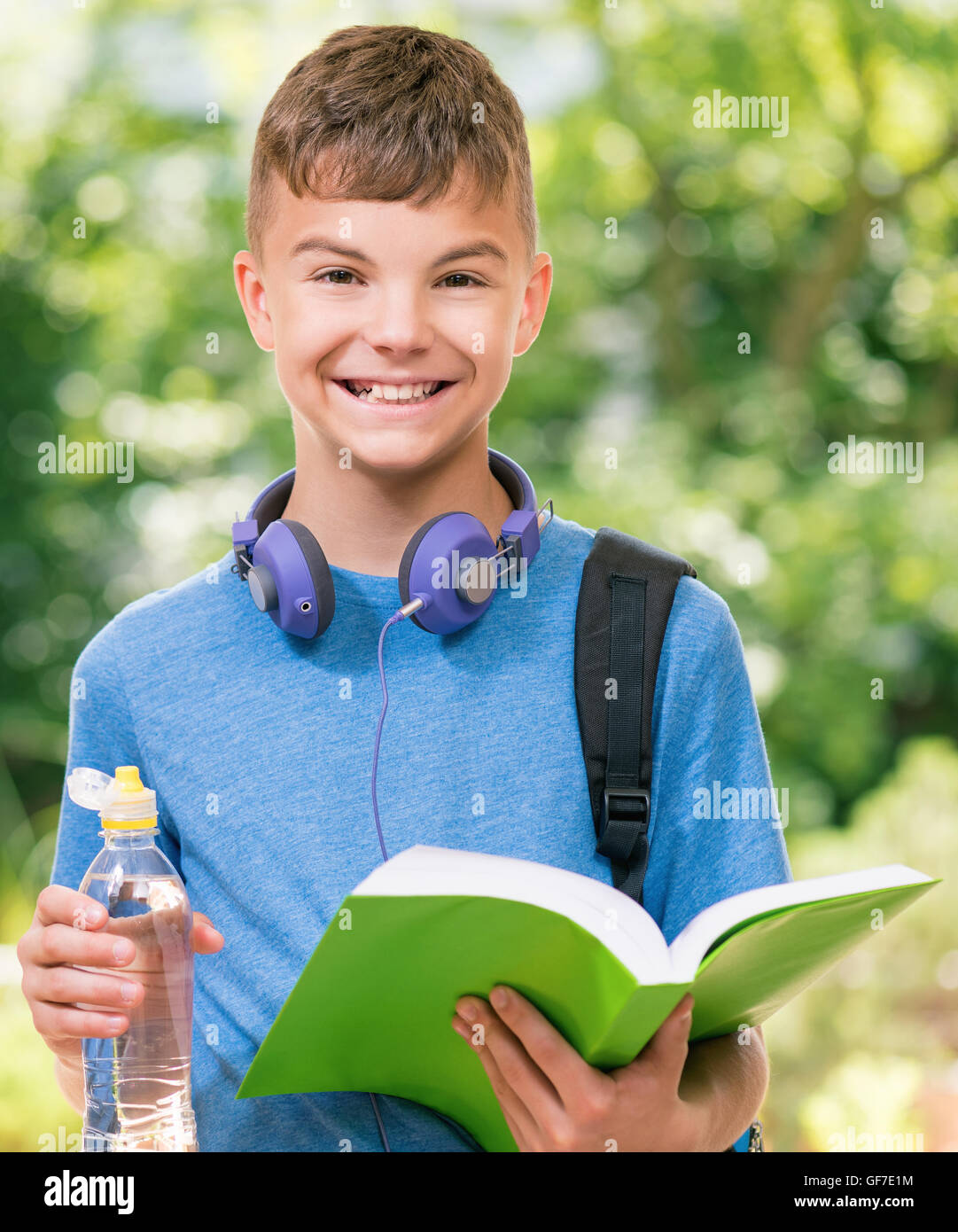 Teen Boy 12-14 Year Old Drinking Fresh Water From A Bottle. Student Teenager  With Headphones And Sunglasses Posing Outdoors. Stock Photo, Picture and  Royalty Free Image. Image 60008603.