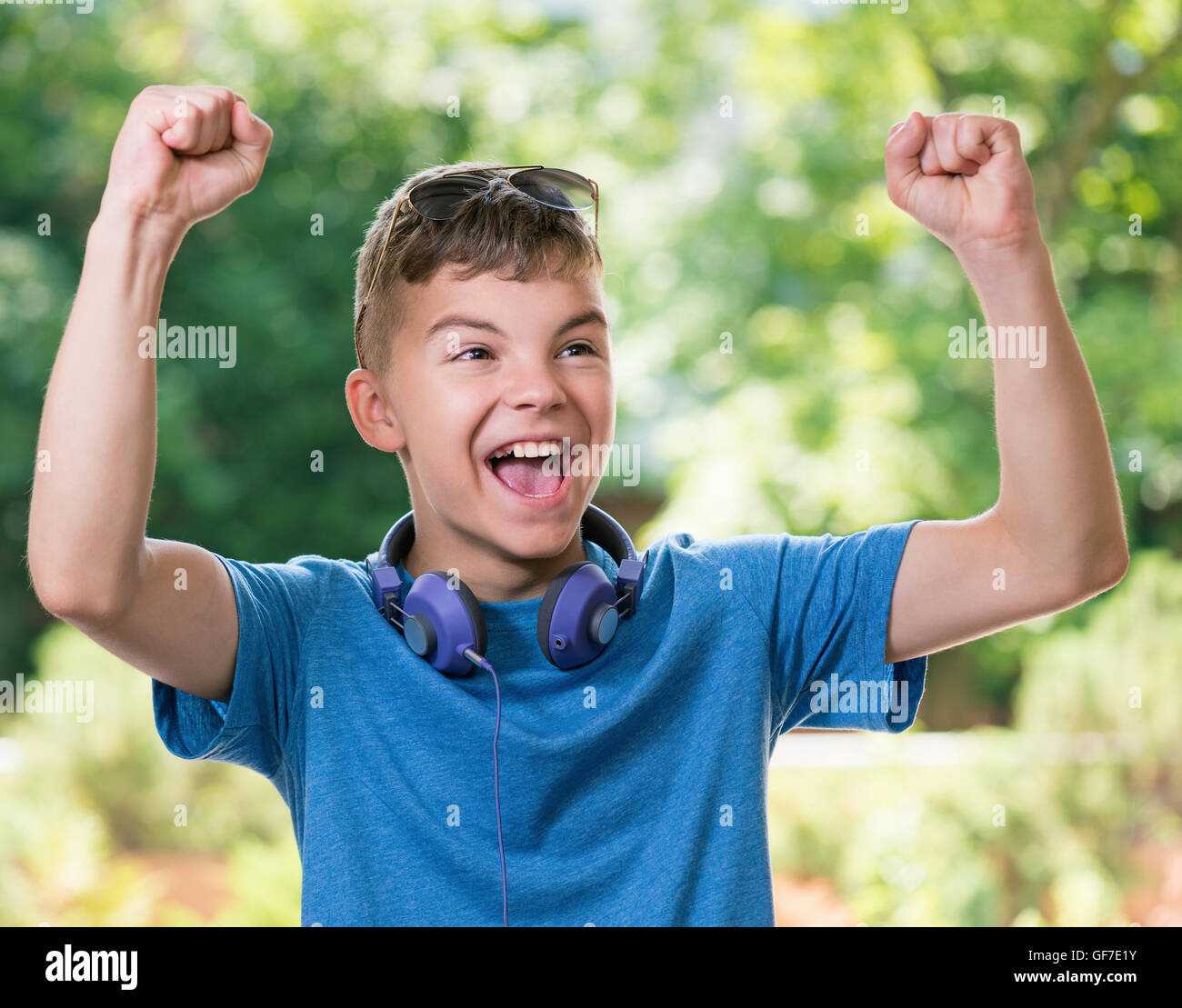 Victory screaming boy Stock Photo