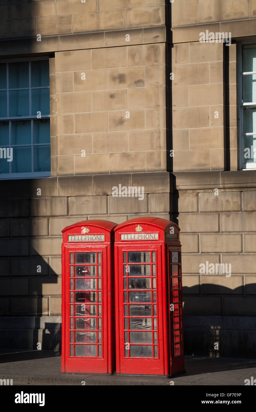 Two old red British telephone boxes in Edinburgh. Stock Photo