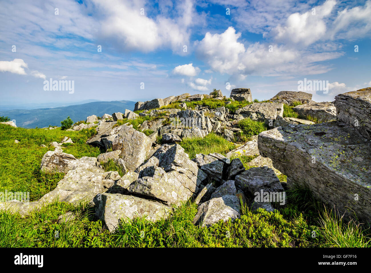 white sharp stones on the hillside on top of mountain range Stock Photo ...