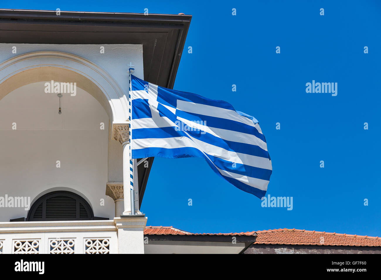 Greek national flag closeup on church in Paphos, Cyprus. Stock Photo
