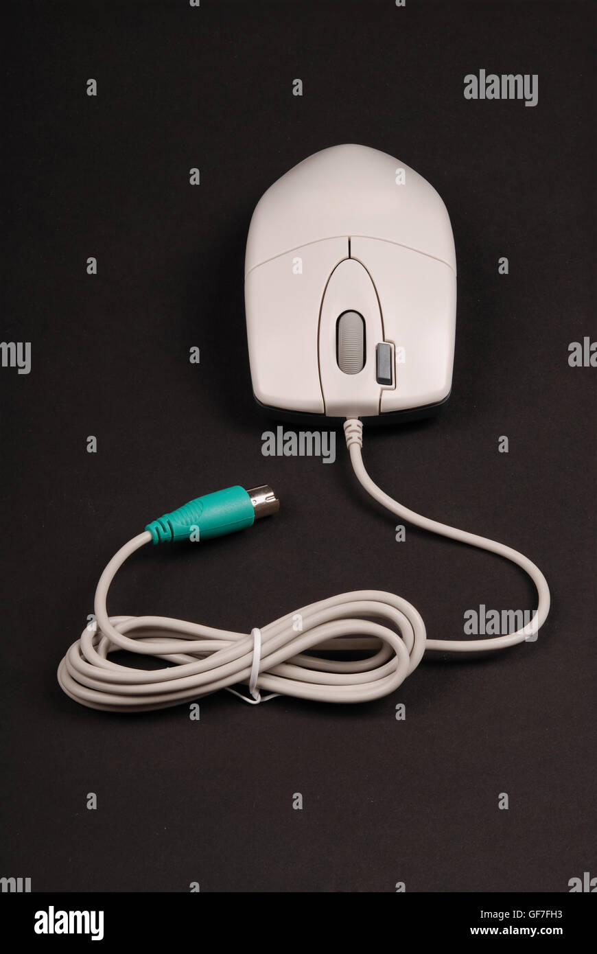 White computer optical mouse isolated on black background with soft