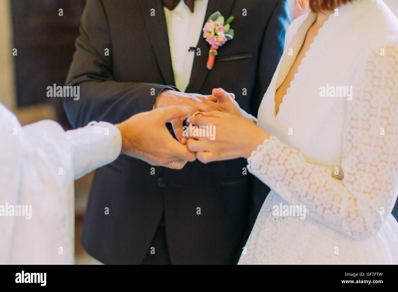 The exchange of rings during an Orthodox wedding, priest wears ring