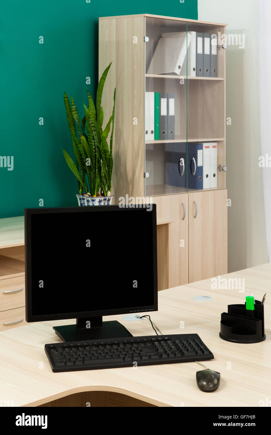 Office Computer Using Computer At Desk computer on a desk in a modern office Stock Photo - Alamy
